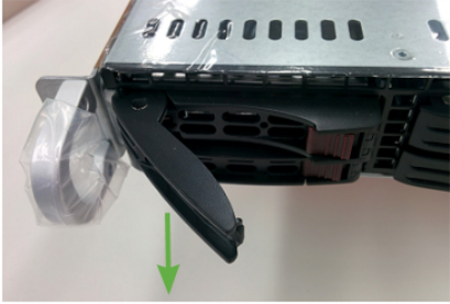 Pulling out black lever on USM appliance disk drive.