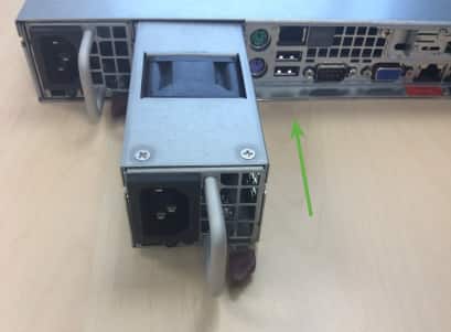 Inserting replacement power supply on USM appliance.